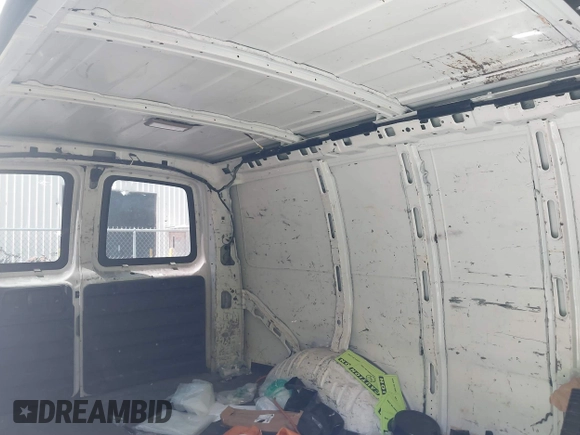2014 Chevrolet Express Cargo Van with VIN 1GCWGFCA2E1210307, listed as a IAAI auction lot 39559260 with 213,814 mi miles. Bid and sale history available at carsss.com. Image 8.