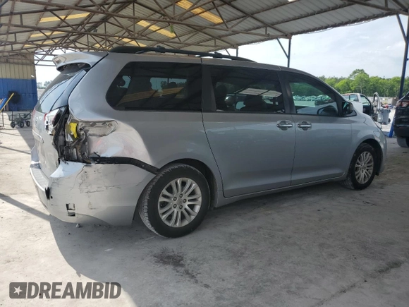 2012 Toyota Sienna XLE AAS с VIN 5TDYK3DC1CS240100, выставлен на аукционе Copart как лот 56975235 с пробегом 251 340 миль миль и Списание • Salvage title. История ставок и продаж доступна на DreamBid. Изображение 3.
