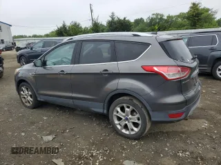 2016 Ford Escape Titanium with VIN 1FMCU9J95GUA58624, listed as a Copart auction lot 59915305 with 102,061 mi miles and Salvage title. Bid and sale history available at DreamBid. Image 2.