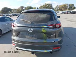 2016 Mazda CX-9 Grand Touring with VIN JM3TCADY8G0114940, listed as a IAAI auction lot 40701187 with 112,311 mi miles and . Bid and sale history available at DreamBid. Image 16.