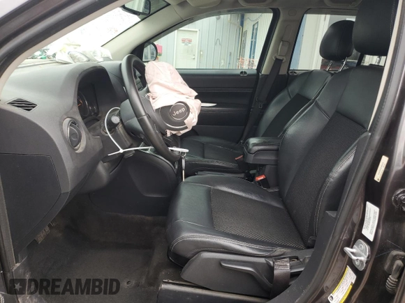 2014 Jeep Compass Latitude with VIN 1C4NJDEB4ED904731, listed as a Copart auction lot 51809165 with 104,760 mi miles and Salvage Title. Bid and sale history available at DreamBid. Image 7.