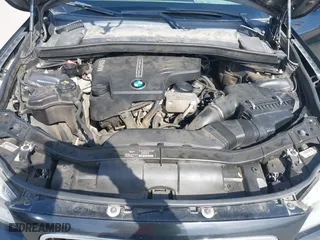 2015 BMW X1 sDrive28i with VIN WBAVM1C59FVW57928, listed as a IAAI auction lot 42056452 with 115,411 mi miles. Bid and sale history available at carsss.com. Image 10.