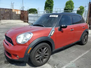 2014 MINI Countryman S with VIN WMWZC3C50EWP25204, listed as a Copart auction lot 59348185 with 143,277 mi miles and Salvage title. Bid and sale history available at DreamBid. Image 1.