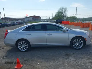 2016 Cadillac XTS Luxury Collection z VIN 2G61M5S33G9107107, wystawiony jako IAAI lot #42072608 z przebiegiem 130 542 mil mil oraz . Historia ofert i sprzedaży dostępna na DreamBid. Obrazek 13.