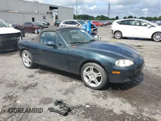2005 Mazda MX-5 Miata LS with VIN JM1NB353X50410655, listed as a Copart auction lot 63337515 with 118,409 mi miles and Clean title. Bid and sale history available at DreamBid. Image 4.