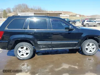2007 Jeep Grand Cherokee Laredo with VIN 1J8GR48K67C523705, listed as a IAAI auction lot 41774281 with 215,572 mi miles. Bid and sale history available at carsss.com. Image 14.