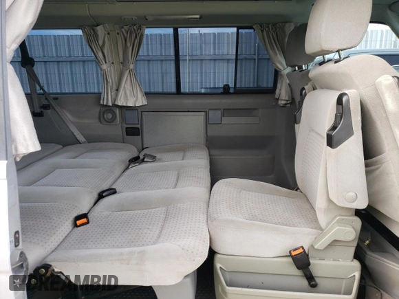 2002 Volkswagen EuroVan MV с VIN WV2NB47052H015757, выставлен на аукционе Copart как лот 81666434 с пробегом 191 543 миль миль и Чистый • Clean title. История ставок и продаж доступна на DreamBid. Изображение 11.