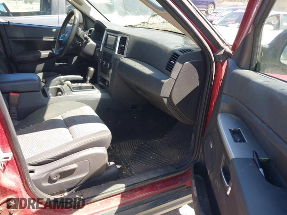 2009 Jeep Grand Cherokee Laredo with VIN 1J8GR48K79C543304, listed as a IAAI auction lot 42151011 with 157,679 mi miles. Bid and sale history available at carsss.com. Image 5.