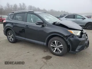 2018 Toyota RAV4 XLE with VIN 2T3RFREV8JW715099, listed as a Copart auction lot 51313485 with 140,107 mi miles and Salvage Title. Bid and sale history available at DreamBid. Image 4.