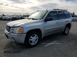 2005 GMC Envoy SLE with VIN 1GKDS13S852164983, listed as a Copart auction lot 87705025 with 158,065 mi miles and Salvage Title. Bid and sale history available at carsss.com. Image 1.