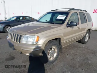 1999 Jeep Grand Cherokee Limited with VIN 1J4GW68N3XC688112, listed as a IAAI auction lot 41640033 with 196,851 mi miles. Bid and sale history available at carsss.com. Image 2.