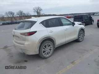 2023 Mazda CX-5 2.5 S Premium Plus Package with VIN JM3KFBEMXP0103278, listed as a IAAI auction lot 40954999 with 100,798 mi miles. Bid and sale history available at carsss.com. Image 4.
