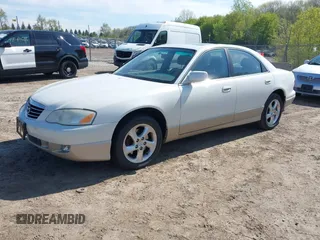 2001 Mazda Millenia z VIN JM1TA221111714677, wystawiony jako IAAI lot #42203182 z przebiegiem 130 847 mil mil oraz . Historia ofert i sprzedaży dostępna na DreamBid. Obrazek 2.