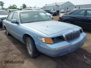 2000 Mercury Grand Marquis LS z VIN 2MEFM75W2YX740018, wystawiony jako IAAI lot #42255754 z przebiegiem 318 651 mil mil oraz . Historia ofert i sprzedaży dostępna na DreamBid. Obrazek 1.
