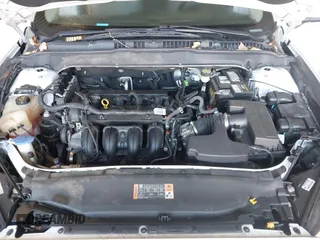 2015 Ford Fusion S with VIN 3FA6P0G73FR296798, listed as a IAAI auction lot 41789594 with 207,233 mi miles. Bid and sale history available at carsss.com. Image 10.