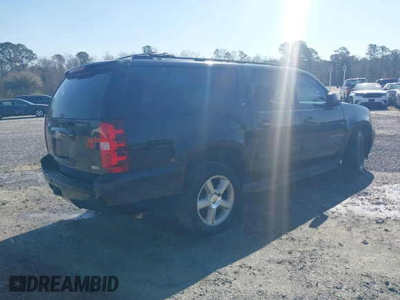 2011 Chevrolet Suburban LT with VIN 1GNSCJE06BR402433, listed as a IAAI auction lot 41819335 with 203,335 mi miles. Bid and sale history available at carsss.com. Image 4.