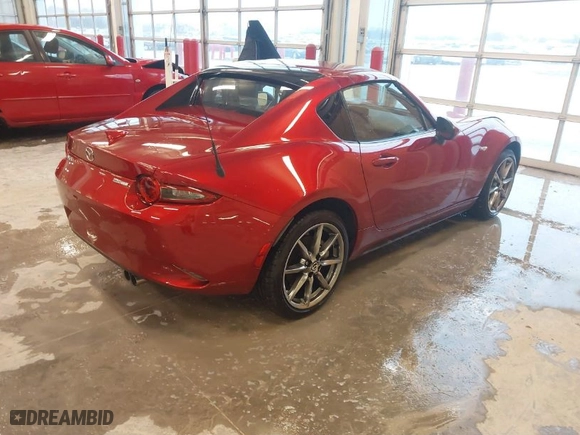 2023 Mazda MX-5 Miata RF Grand Touring with VIN JM1NDAM75P0558590, listed as a IAAI auction lot 41479610 with 4,446 mi miles. Bid and sale history available at carsss.com. Image 4.