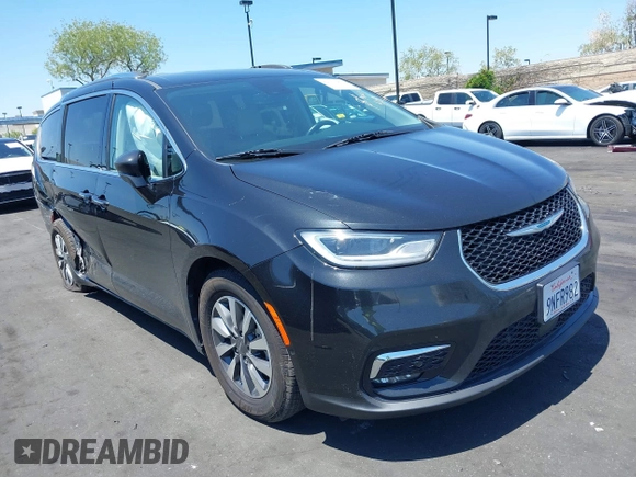 2021 Chrysler Pacifica Hybrid Touring L with VIN 2C4RC1L71MR599631, listed as a IAAI auction lot 42151965 with 67,401 mi miles and . Bid and sale history available at DreamBid. Image 1.