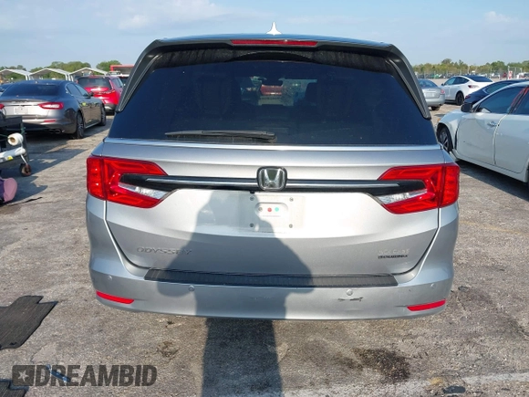 2023 Honda Odyssey Touring with VIN 5FNRL6H86PB020700, listed as a IAAI auction lot 41961098 with 66,512 mi miles and . Bid and sale history available at DreamBid. Image 16.