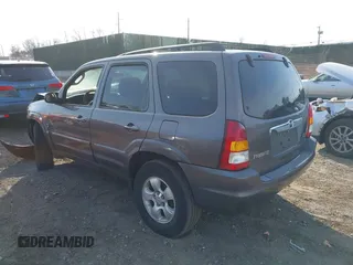 2004 Mazda Tribute LX with VIN 4F2CZ941X4KM19302, listed as a IAAI auction lot 41791389 with 123,036 mi miles. Bid and sale history available at carsss.com. Image 3.