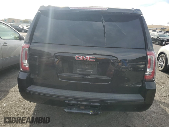 2019 GMC Yukon SLE with VIN 1GKS1AKC2KR101675, listed as a Copart auction lot 87256804 with 144,572 mi miles and Salvage Title. Bid and sale history available at carsss.com. Image 6.