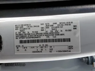 2023 Ford F-150 Lightning Pro with VIN 1FT6W1EVXPWG44972, listed as a Copart auction lot 60303485 with 19,788 mi miles and Salvage title. Bid and sale history available at DreamBid. Image 12.