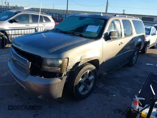 2007 Chevrolet Suburban LS with VIN 1GNFC16037J337224, listed as a IAAI auction lot 41297347 with 256,162 mi miles. Bid and sale history available at carsss.com. Image 2.