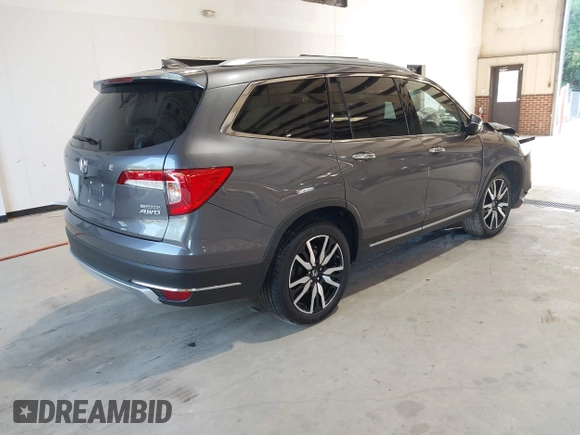 2021 Honda Pilot Touring 8-Passenger with VIN 5FNYF6H95MB048527, listed as a IAAI auction lot 42542138 with 40,584 mi miles and . Bid and sale history available at DreamBid. Image 4.