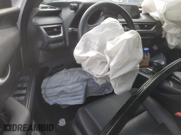 2021 Lexus UX 250h z VIN JTHX9JBH1M2037919, wystawiony jako Copart lot #46970385 z przebiegiem Nie podano mil oraz Szkoda całkowita • Salvage title. Historia ofert i sprzedaży dostępna na DreamBid. Obrazek 8.