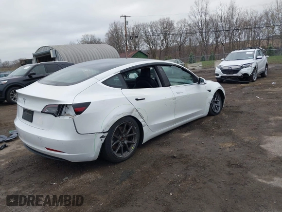 2020 Tesla Model 3 Standard Range Plus with VIN 5YJ3E1EA7LF659172, listed as a IAAI auction lot 42017026 with 32,104 mi miles. Bid and sale history available at carsss.com. Image 4.