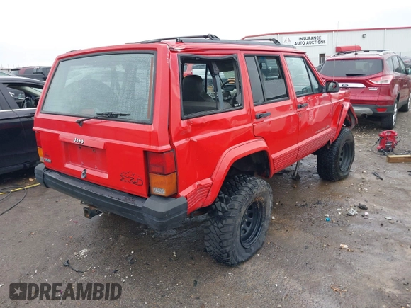 1996 Jeep Cherokee Sport with VIN 1J4FJ68S6TL299152, listed as a IAAI auction lot 41004736 with 277,819 mi miles. Bid and sale history available at carsss.com. Image 4.