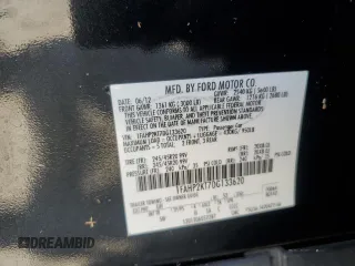 2013 Ford Taurus SHO z VIN 1FAHP2KT7DG133620, wystawiony jako Copart lot #54219005 z przebiegiem Nie podano mil oraz Szkoda całkowita • Salvage title. Historia ofert i sprzedaży dostępna na DreamBid. Obrazek 12.
