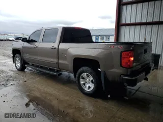 2015 Chevrolet Silverado 1500 LT with VIN 1GCUKREC5FF199913, listed as a Copart auction lot 58476584 with 129,616 mi miles and Salvage Title. Bid and sale history available at carsss.com. Image 2.
