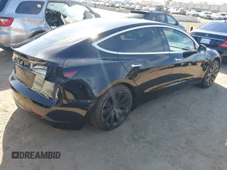 2018 Tesla Model 3 Long Range Battery with VIN 5YJ3E1EA0JF056979, listed as a IAAI auction lot 41865849 with 97,319 mi miles. Bid and sale history available at carsss.com. Image 4.