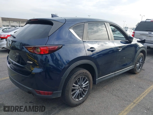 2019 Mazda CX-5 Touring with VIN JM3KFACM5K0697137, listed as a IAAI auction lot 41720253 with 50,416 mi miles. Bid and sale history available at carsss.com. Image 4.