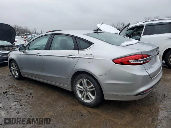 2018 Ford Fusion SE z VIN 3FA6P0H79JR270777, wystawiony jako Copart lot #45319755 z przebiegiem 69 152 mil mil oraz Szkoda całkowita • Salvage title. Historia ofert i sprzedaży dostępna na DreamBid. Obrazek 2.
