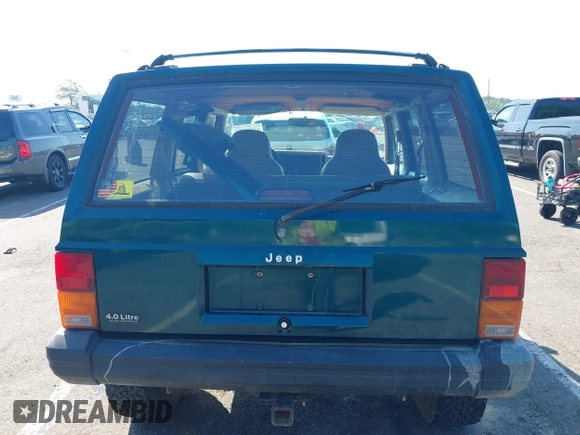 1995 Jeep Cherokee Sport z VIN 1J4FJ68S7SL623451, wystawiony jako IAAI lot #42581407 z przebiegiem 160 581 mil mil oraz . Historia ofert i sprzedaży dostępna na DreamBid. Obrazek 16.