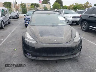 2019 Tesla Model 3 Mid Range with VIN 5YJ3E1EA2KF362048, listed as a IAAI auction lot 40141734 with 70,321 mi miles and . Bid and sale history available at carsss.com. Image 11.