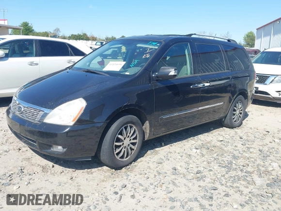 2011 Kia Sedona EX with VIN KNDMH4C76B6398261, listed as a IAAI auction lot 41894696 with 180,297 mi miles. Bid and sale history available at carsss.com. Image 2.