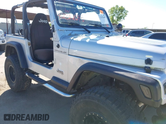 2002 Jeep Wrangler X with VIN 1J4FA39S42P763835, listed as a IAAI auction lot 42302645 with 233,634 mi miles and . Bid and sale history available at DreamBid. Image 6.