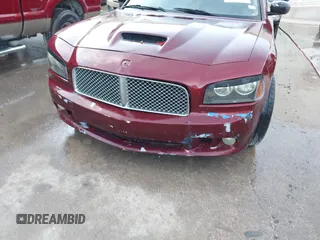 2006 Dodge Charger R/T with VIN 2B3KA53H36H260418, listed as a IAAI auction lot 42126007 with 242,331 mi miles and . Bid and sale history available at carsss.com. Image 6.