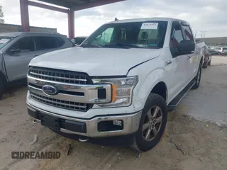 2019 Ford F-150 XL with VIN 1FTEW1E50KFA47687, listed as a IAAI auction lot 42021043 with 129,337 mi miles. Bid and sale history available at carsss.com. Image 2.