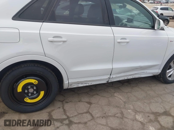 2018 Audi Q3 Premium z VIN WA1BCCFSXJR028356, wystawiony jako IAAI lot #41761544 z przebiegiem 82 877 mil mil oraz . Historia ofert i sprzedaży dostępna na DreamBid. Obrazek 6.