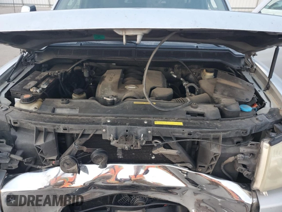 2005 Nissan Titan SE with VIN 1N6BA06B45N539629, listed as a Copart auction lot 82527074 with 154,255 mi miles and Salvage title. Bid and sale history available at DreamBid. Image 12.