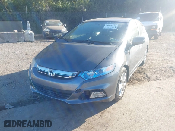 2012 Honda Insight EX z VIN JHMZE2H70CS004787, wystawiony jako IAAI lot #40668475 z przebiegiem 127 599 mil mil oraz . Historia ofert i sprzedaży dostępna na DreamBid. Obrazek 6.