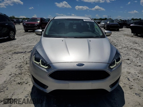 2017 Ford Focus SE with VIN 1FADP3F27HL223918, listed as a Copart auction lot 57464685 with 134,253 mi miles and Salvage title. Bid and sale history available at DreamBid. Image 5.