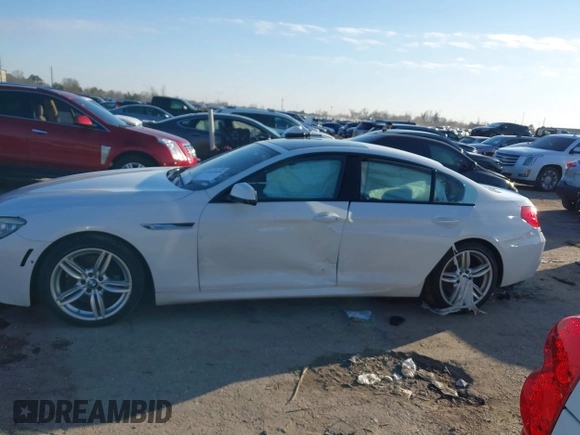 2015 BMW 6 Series 640i xDrive with VIN WBA6B8C50FD453317, listed as a IAAI auction lot 41635430 with 77,811 mi miles and . Bid and sale history available at DreamBid. Image 14.