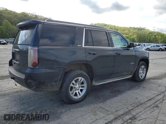 2015 GMC Yukon SLT with VIN 1GKS2BKC6FR145140, listed as a Copart auction lot 55451365 with 216,522 mi miles and Salvage Title. Bid and sale history available at DreamBid. Image 3.