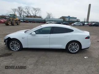 2016 Tesla Model S 70 kWh Battery with VIN 5YJSA1E15GF135841, listed as a IAAI auction lot 41846535 with 87,312 mi miles. Bid and sale history available at carsss.com. Image 15.