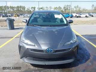 2021 Toyota Prius L Eco with VIN JTDKAMFU4M3134778, listed as a IAAI auction lot 41843429 with 145,757 mi miles. Bid and sale history available at carsss.com. Image 12.